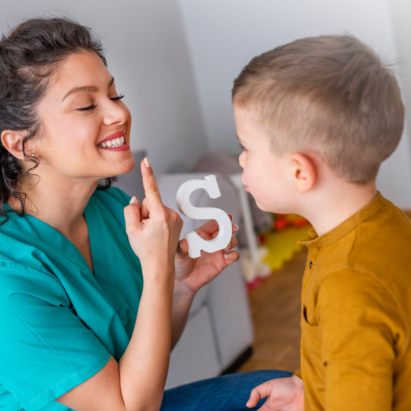 Speech-Language therapist with little boy
